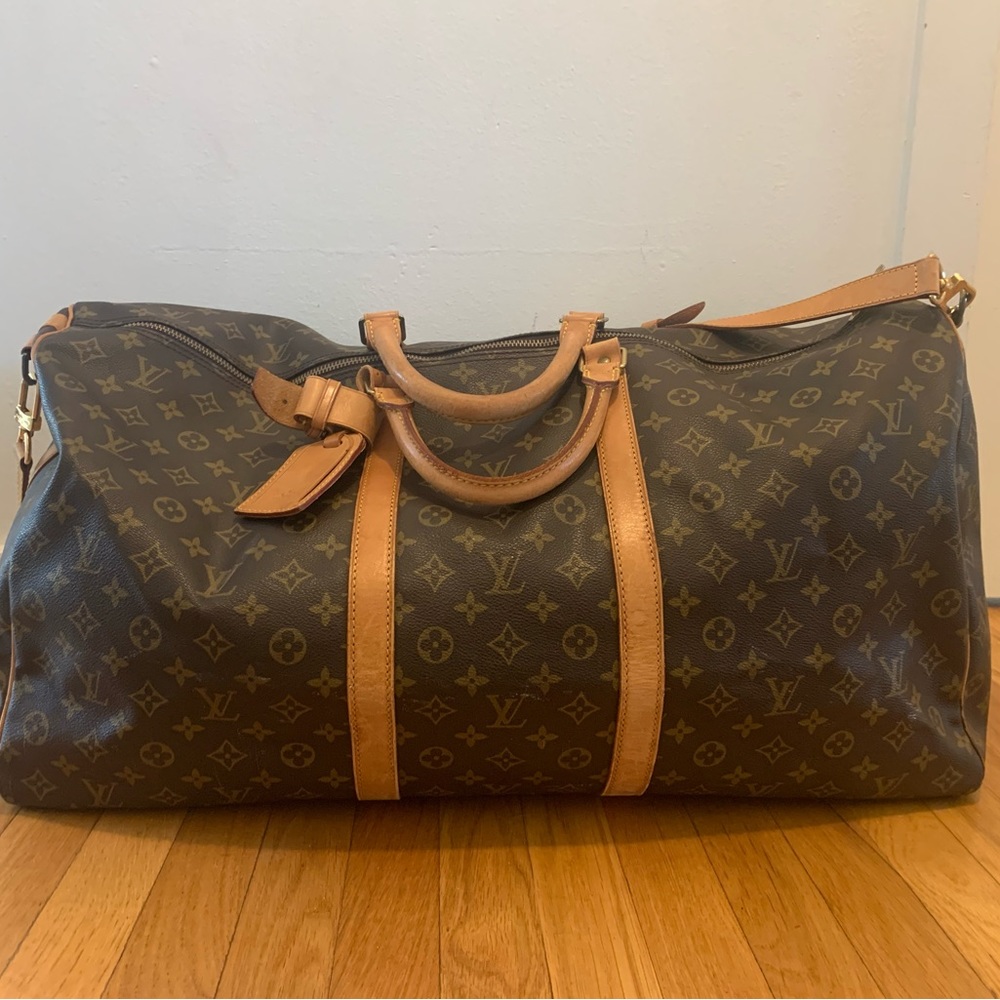 Authentic Louis Vuitton Keepall 60 with original strap and luggage tags VI8911